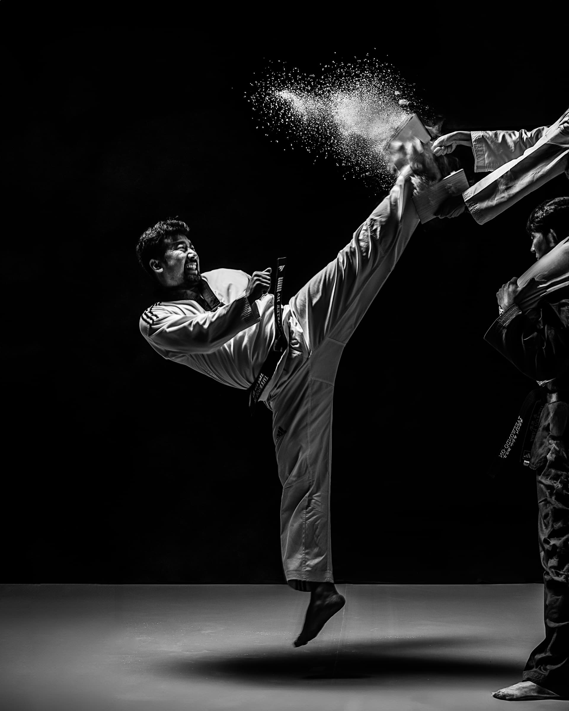 Students practicing Taekwondo kicks and martial arts techniques at Taekwondo ON Calgary academy